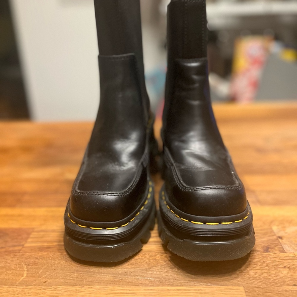 Stylish Black Boots with Yellow Accents